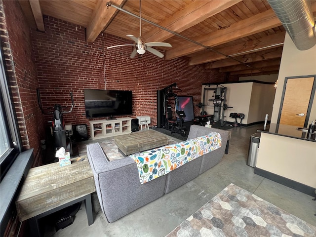 1113 Washington Ave Unit 510, Saint Louis, MO 63101 - living area with ceiling fan, concrete floors, wood ceiling, a wood stove, and beamed ceiling