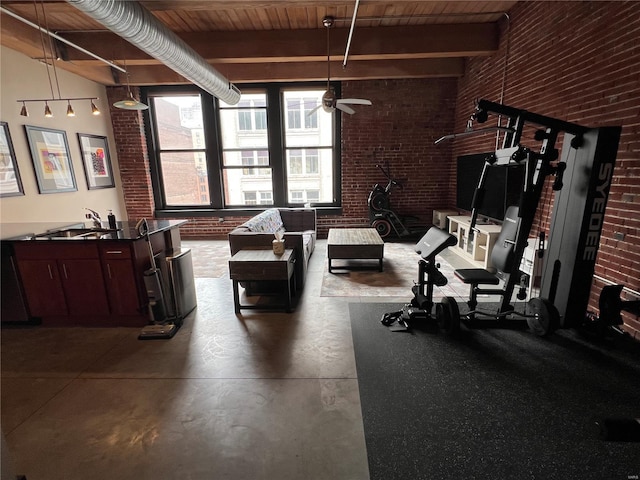 1113 Washington Ave Unit 510, Saint Louis, MO 63101 - workout room featuring brick wall, a sink, and a ceiling fan