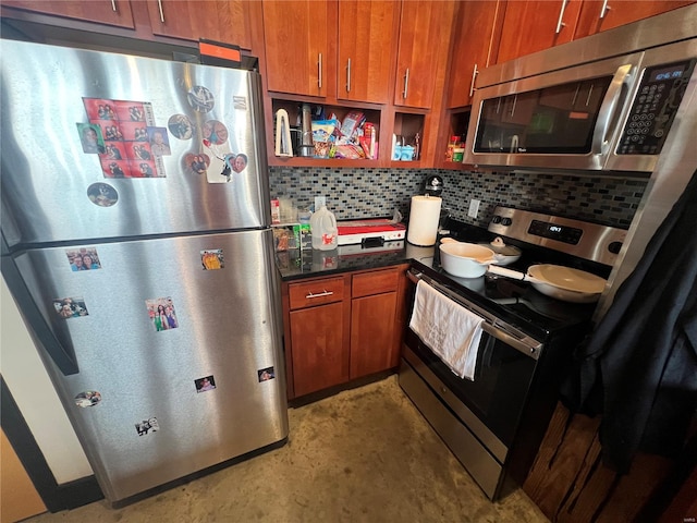 1113 Washington Ave Unit 510, Saint Louis, MO 63101 - kitchen featuring stainless steel appliances, decorative backsplash, unfinished concrete floors, and brown cabinets