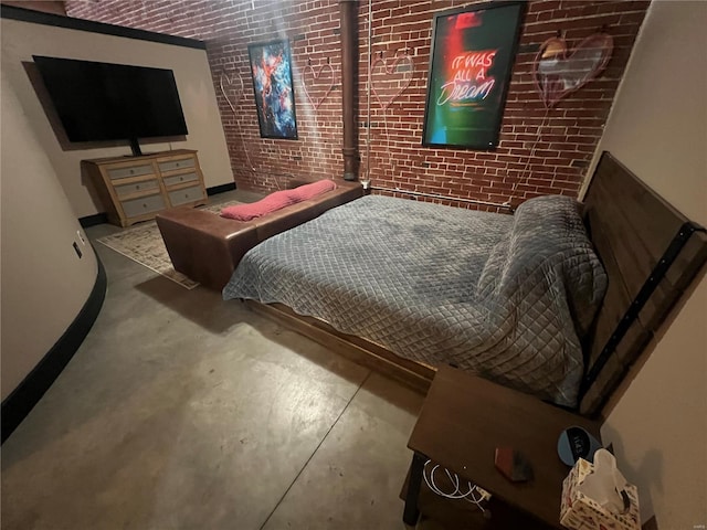 1113 Washington Ave Unit 510, Saint Louis, MO 63101 - bedroom with brick wall, concrete flooring, and baseboards