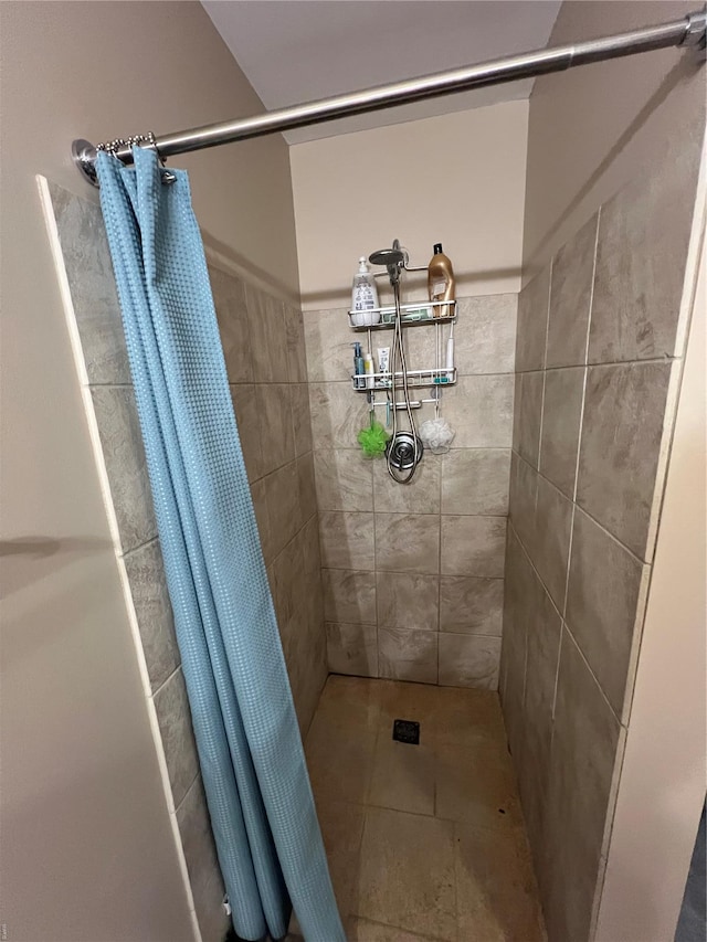 1113 Washington Ave Unit 510, Saint Louis, MO 63101 - bathroom featuring a tile shower and tile patterned flooring