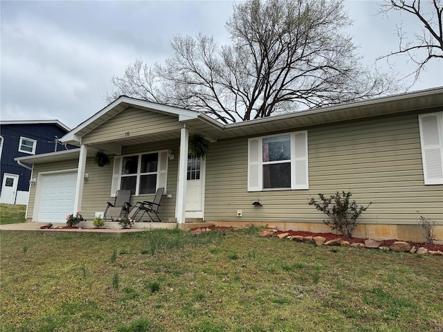 16 Wood St, Park Hills, MO 63601 - view of front of house with covered porch, an attached garage, and a front lawn