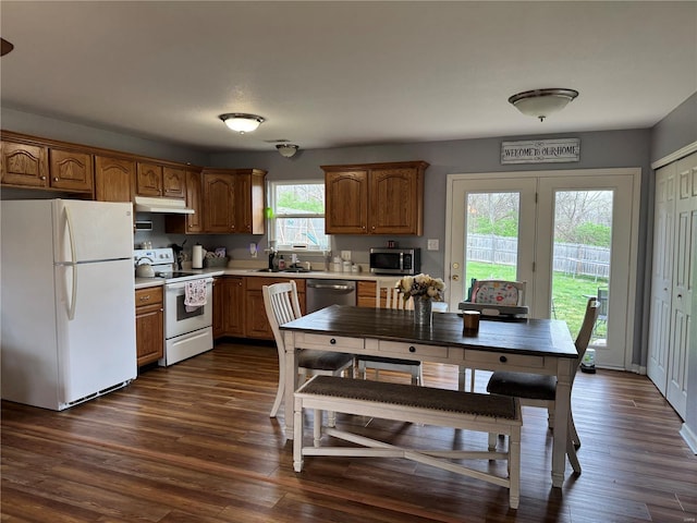 16 Wood St, Park Hills, MO 63601 - kitchen with appliances with stainless steel finishes, light countertops, under cabinet range hood, and brown cabinets