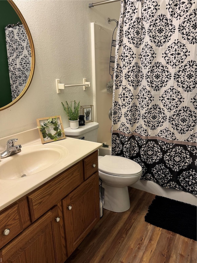 16 Wood St, Park Hills, MO 63601 - full bathroom with wood finished floors, vanity, toilet, and a textured wall