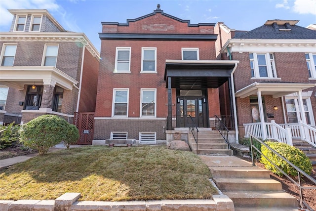 3726 Wyoming St, Saint Louis, MO 63116 - american foursquare style home with brick siding and a front yard