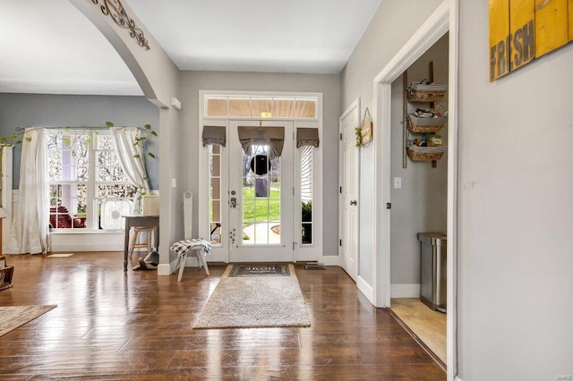 21933 Pike 215, Annada, MO 63330 - entryway featuring arched walkways, baseboards, and wood finished floors