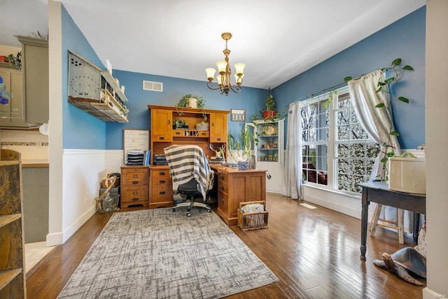 21933 Pike 215, Annada, MO 63330 - office space featuring wood finished floors, a chandelier, and baseboards