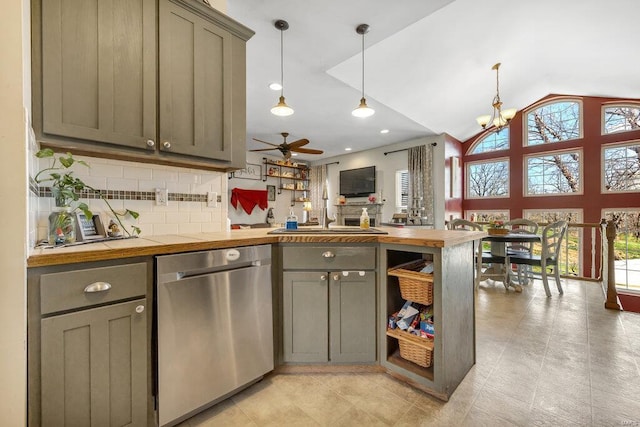 21933 Pike 215, Annada, MO 63330 - kitchen with stainless steel dishwasher, plenty of natural light, a peninsula, a sink, and lofted ceiling