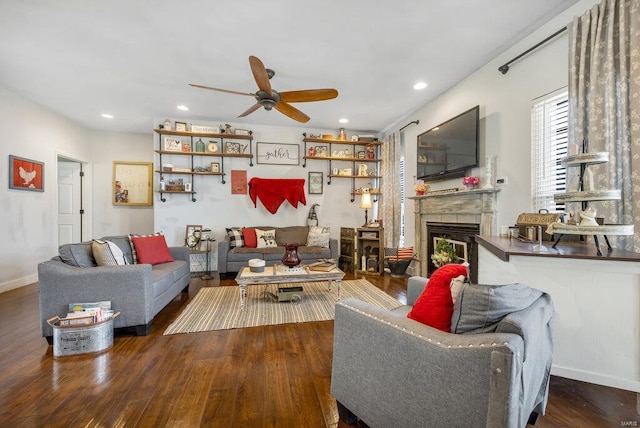 21933 Pike 215, Annada, MO 63330 - living area featuring ceiling fan, wood finished floors, a tile fireplace, recessed lighting, and baseboards