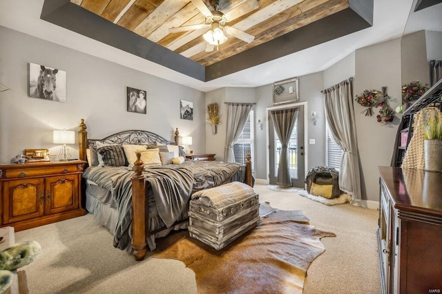 21933 Pike 215, Annada, MO 63330 - bedroom with a tray ceiling, light colored carpet, access to outside, and a ceiling fan