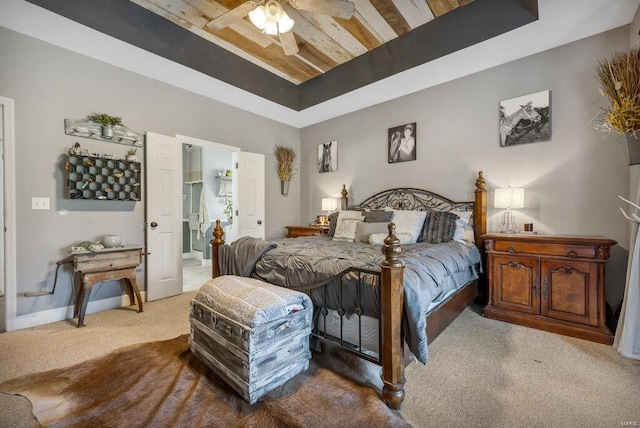 21933 Pike 215, Annada, MO 63330 - carpeted bedroom featuring a raised ceiling, a ceiling fan, and connected bathroom