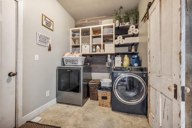21933 Pike 215, Annada, MO 63330 - clothes washing area with washer and clothes dryer and baseboards