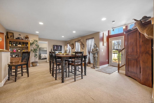 21933 Pike 215, Annada, MO 63330 - dining room featuring light colored carpet, recessed lighting, baseboards, and a dry bar