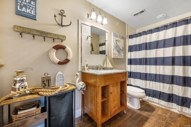 21933 Pike 215, Annada, MO 63330 - full bath with wood finished floors, toilet, vanity, and a shower with curtain