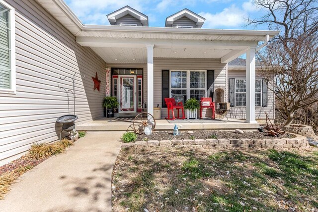 21933 Pike 215, Annada, MO 63330 - view of exterior entry with a porch