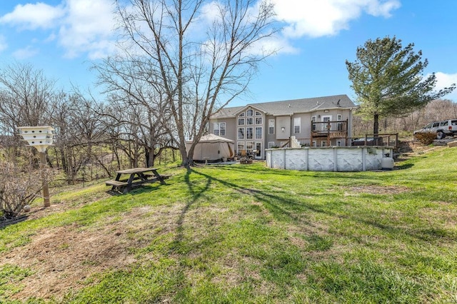 21933 Pike 215, Annada, MO 63330 - view of grassy yard with a covered pool and a wooden deck