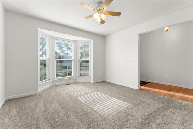 1719 Ambrose Terrace Dr, Swansea, IL 62226 - unfurnished room with carpet flooring, baseboards, and ceiling fan