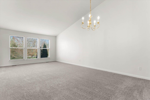 1719 Ambrose Terrace Dr, Swansea, IL 62226 - carpeted empty room with lofted ceiling, a chandelier, and baseboards
