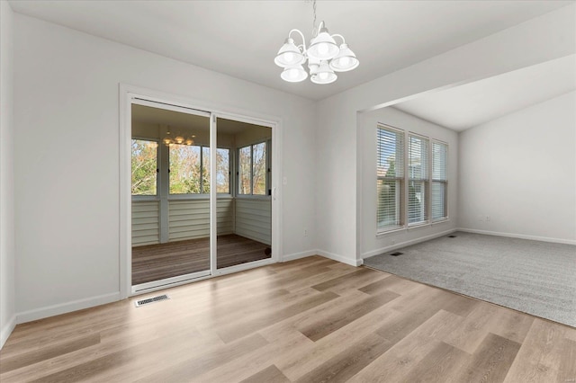 1719 Ambrose Terrace Dr, Swansea, IL 62226 - empty room with a chandelier, light wood-type flooring, and baseboards