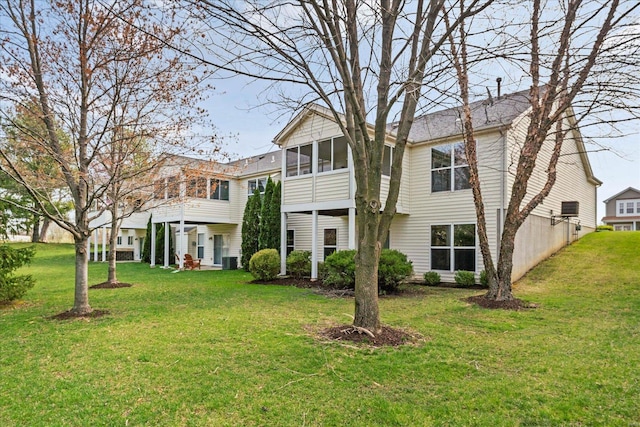1719 Ambrose Terrace Dr, Swansea, IL 62226 - rear view of house featuring a sunroom, a lawn, and cooling unit