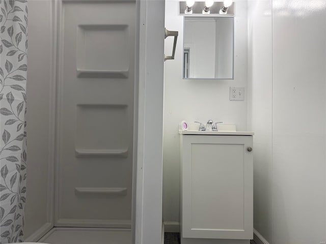 bathroom featuring vanity and a shower with curtain