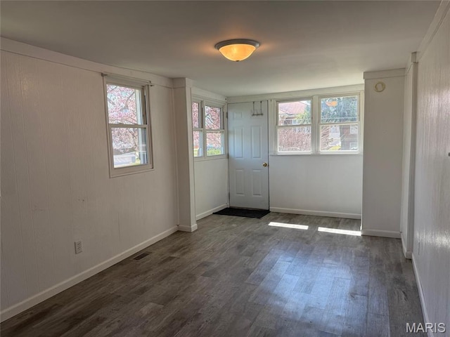 300 E 2nd St, Pana, IL 62557 - entrance foyer featuring dark wood-type flooring and baseboards