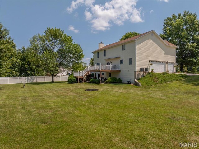 1005 Highland Estates Dr, Wentzville, MO 63385 - rear view of property with a wooden deck, a chimney, and stairs