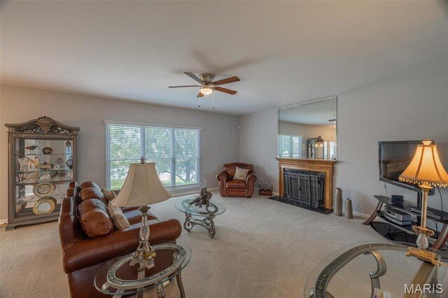 1005 Highland Estates Dr, Wentzville, MO 63385 - carpeted living area featuring ceiling fan, a fireplace, and baseboards