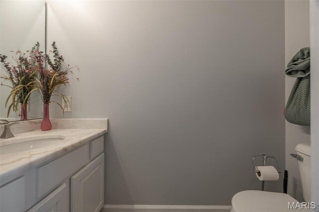 1005 Highland Estates Dr, Wentzville, MO 63385 - half bathroom with vanity, toilet, and baseboards