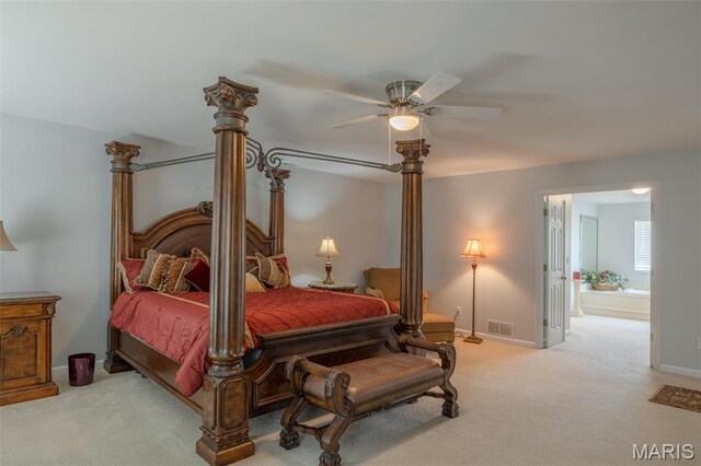 1005 Highland Estates Dr, Wentzville, MO 63385 - bedroom featuring light carpet, baseboards, connected bathroom, and a ceiling fan