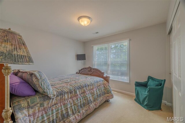 1005 Highland Estates Dr, Wentzville, MO 63385 - carpeted bedroom featuring a closet and baseboards