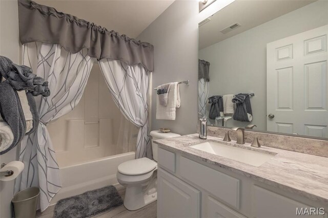 1005 Highland Estates Dr, Wentzville, MO 63385 - bathroom with vanity, shower / bath combo with shower curtain, and toilet