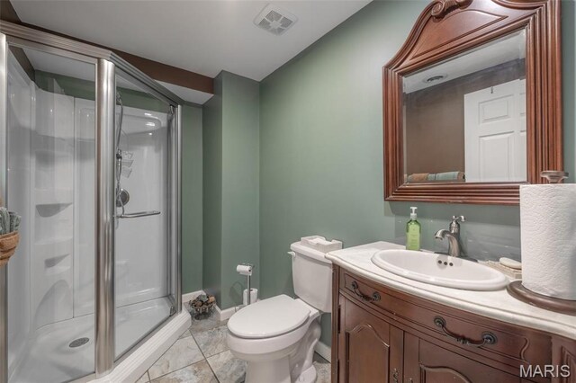 1005 Highland Estates Dr, Wentzville, MO 63385 - bathroom featuring a shower stall, toilet, vanity, baseboards, and marble look tiles