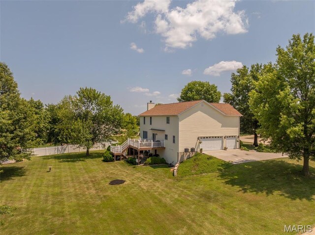 1005 Highland Estates Dr, Wentzville, MO 63385 - back of property featuring a wooden deck, a chimney, driveway, and stairway