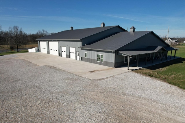 25371 Audrain Road 808, Mexico, MO 65265 - view of front of property with concrete driveway, a garage, and a chimney