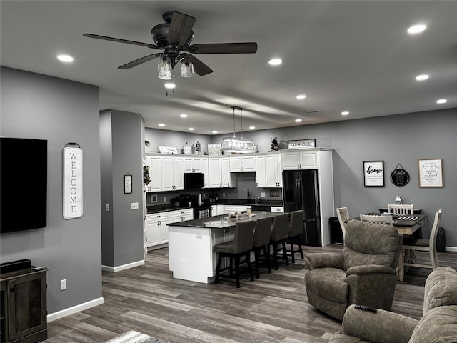 25371 Audrain Road 808, Mexico, MO 65265 - living area with recessed lighting, a ceiling fan, dark wood-type flooring, and baseboards