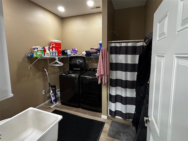 25371 Audrain Road 808, Mexico, MO 65265 - full bath with independent washer and dryer, wood finished floors, a sink, and a shower with curtain