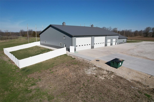25371 Audrain Road 808, Mexico, MO 65265 - view of side of home featuring a garage and driveway