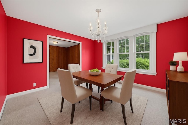 430 Cap Au Gris St, Troy, MO 63379 - dining space with light colored carpet, baseboards, and a chandelier