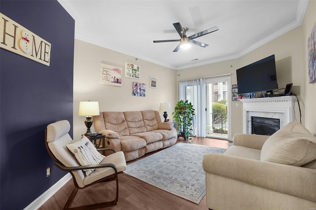 13115 Mill Crossing Ct Unit 106, Saint Louis, MO 63141 - living room featuring wood finished floors, a ceiling fan, a premium fireplace, ornamental molding, and baseboards