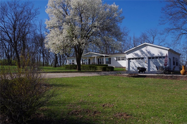 1077 Creech School Rd, Troy, MO 63379 - view of home's exterior with driveway, an attached garage, and a lawn