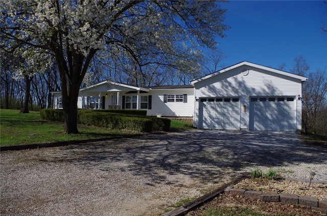 1077 Creech School Rd, Troy, MO 63379 - single story home with gravel driveway and a garage