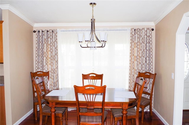 1077 Creech School Rd, Troy, MO 63379 - dining space with a chandelier, baseboards, dark wood finished floors, crown molding, and arched walkways