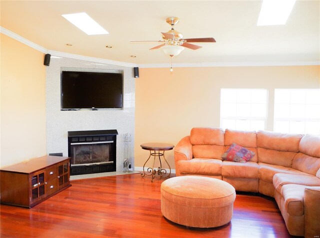 1077 Creech School Rd, Troy, MO 63379 - living room with wood finished floors, a ceiling fan, crown molding, and a large fireplace