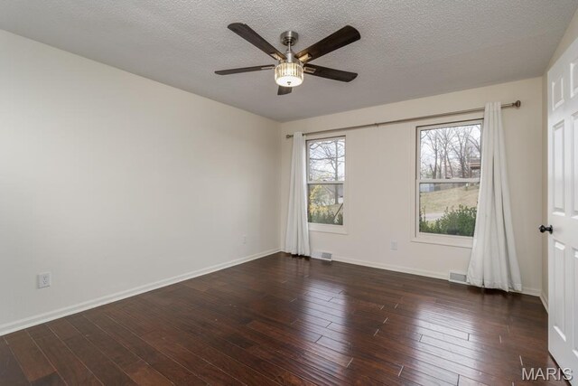 212 Tremont Dr, Waynesville, MO 65583 - unfurnished room with ceiling fan, a textured ceiling, wood finished floors, and baseboards