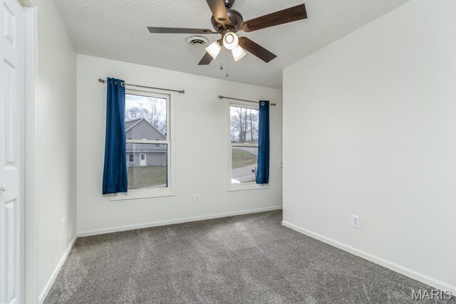 212 Tremont Dr, Waynesville, MO 65583 - carpeted spare room with a ceiling fan, baseboards, and a textured ceiling