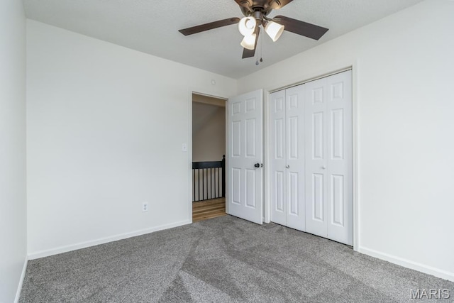 212 Tremont Dr, Waynesville, MO 65583 - unfurnished bedroom featuring carpet, baseboards, a closet, and a ceiling fan