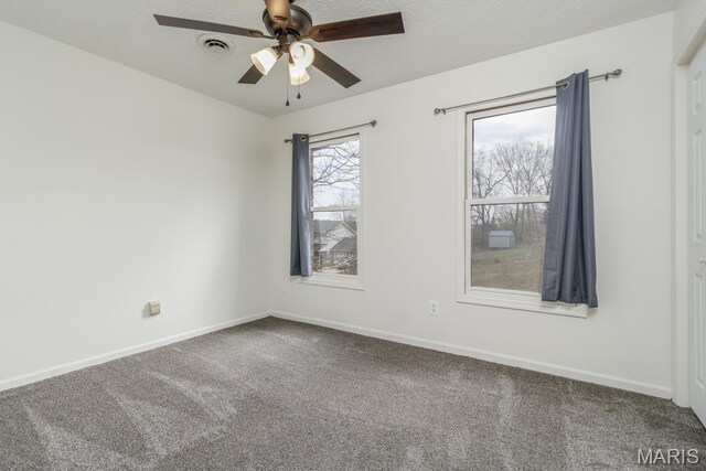 212 Tremont Dr, Waynesville, MO 65583 - unfurnished room with carpet floors, a ceiling fan, and baseboards