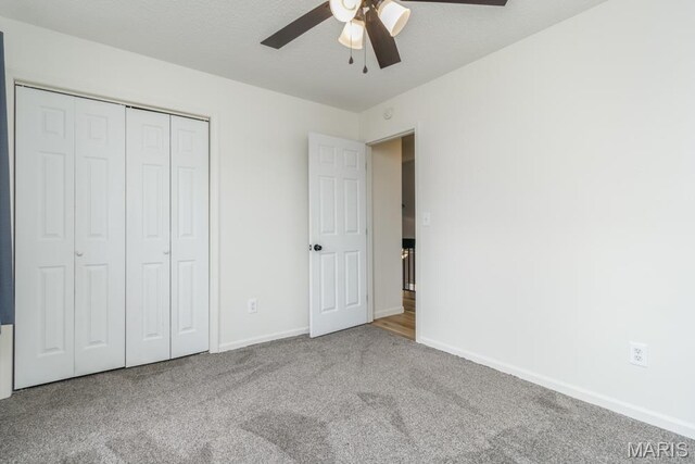 212 Tremont Dr, Waynesville, MO 65583 - unfurnished bedroom featuring carpet floors, baseboards, a closet, and ceiling fan