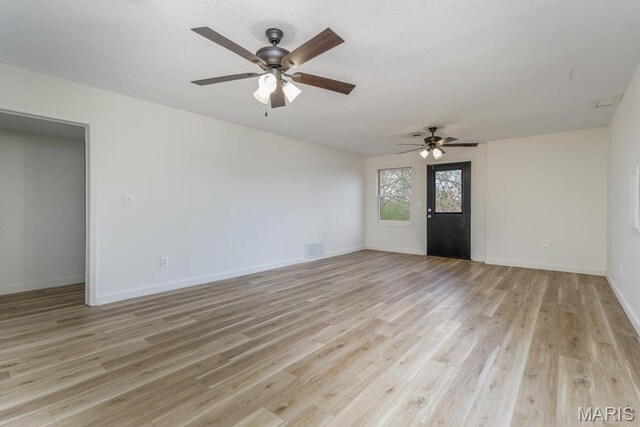 212 Tremont Dr, Waynesville, MO 65583 - empty room featuring ceiling fan, light wood-type flooring, and baseboards